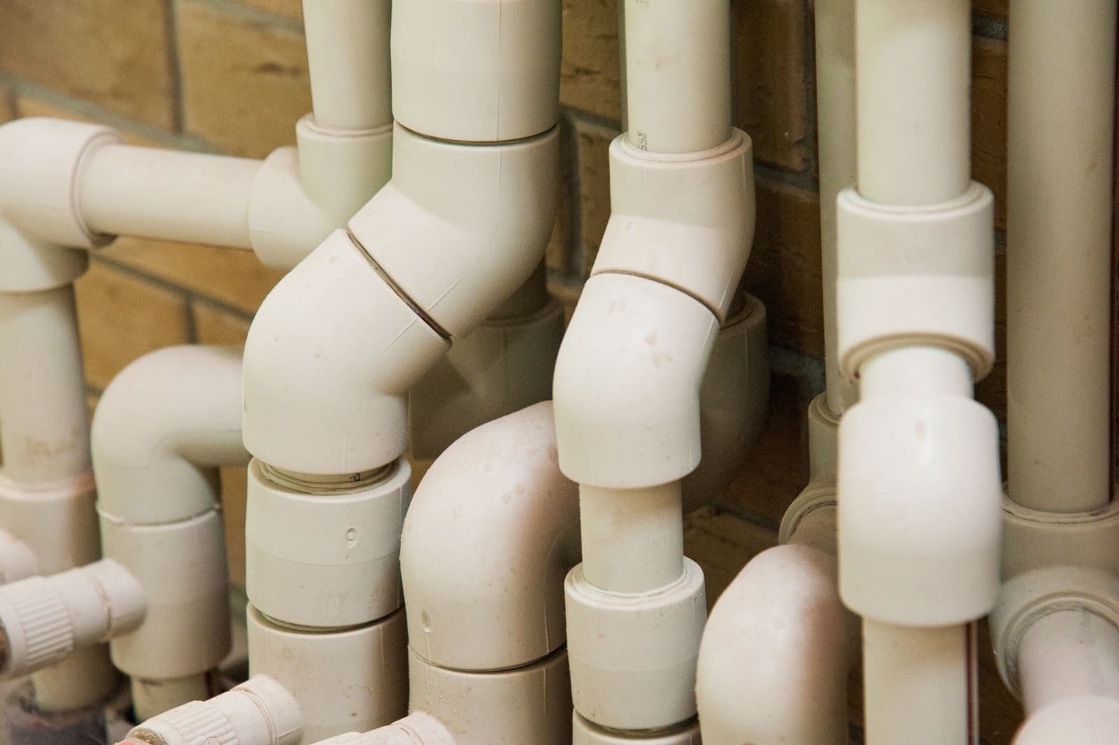White pipes and fittings in a home plumbing system