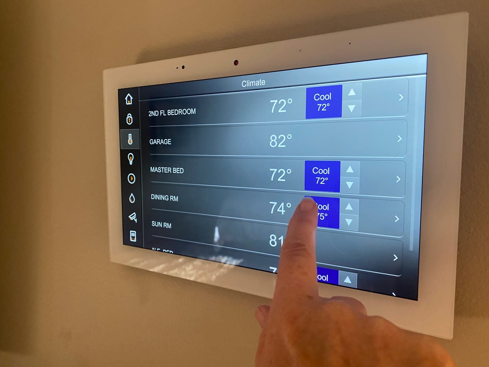 A smart home control panel showing different temperatures for each room