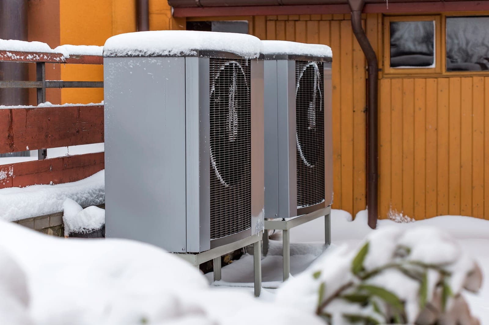 An outdoor heat pump unit running on a frosty winter morning