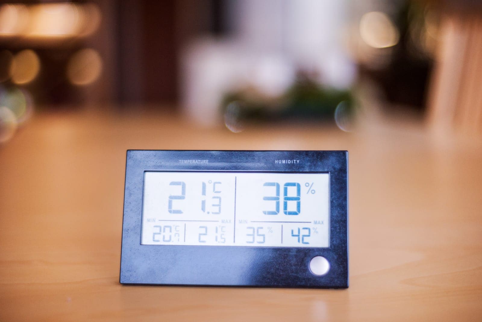 A digital hygrometer showing indoor humidity levels in a home